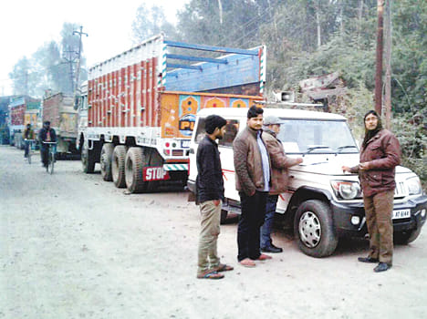18 overloaded trucks and dumpers on the highway