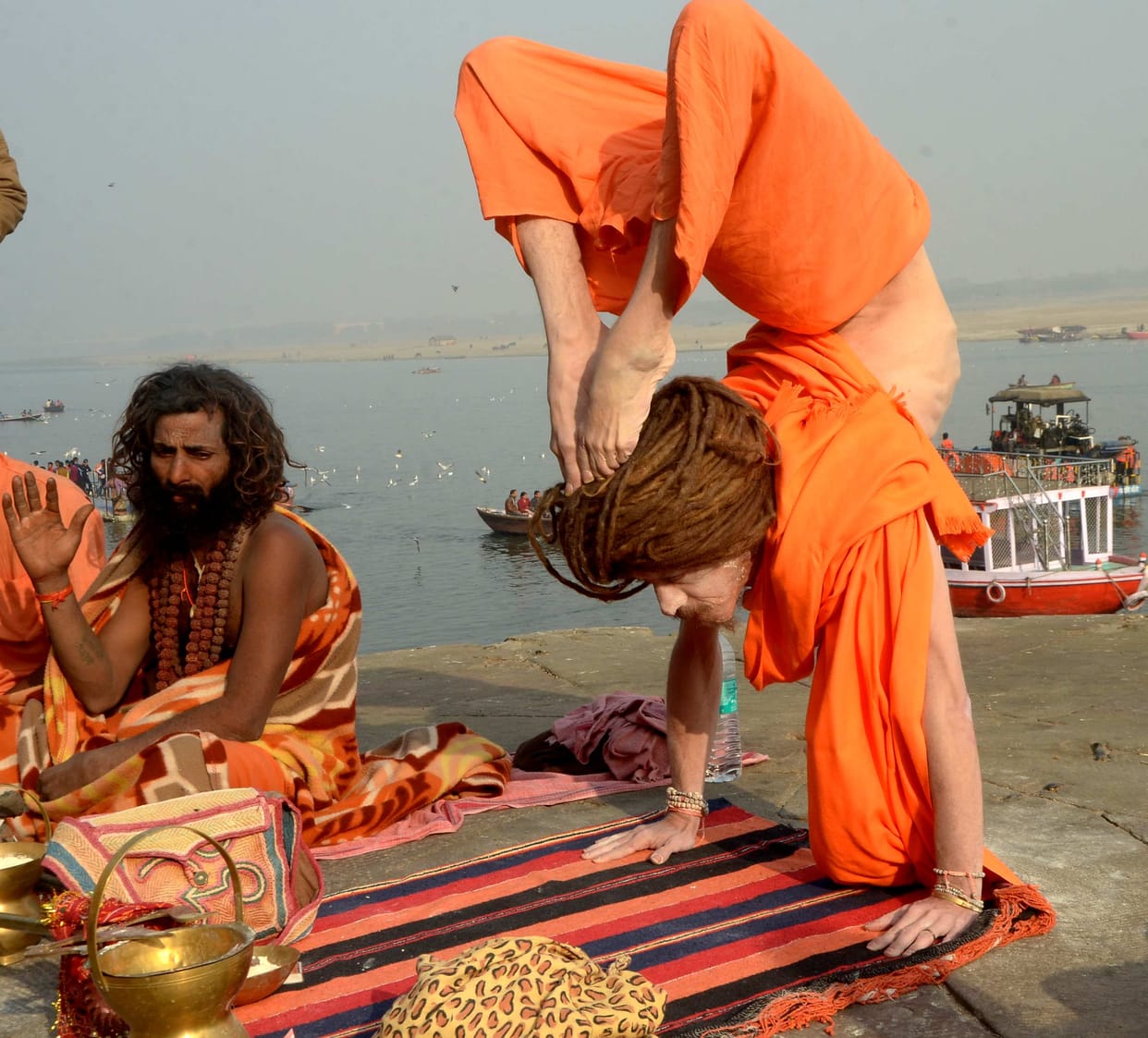 Foreign saint yoga on varanasi ganga ghat 
