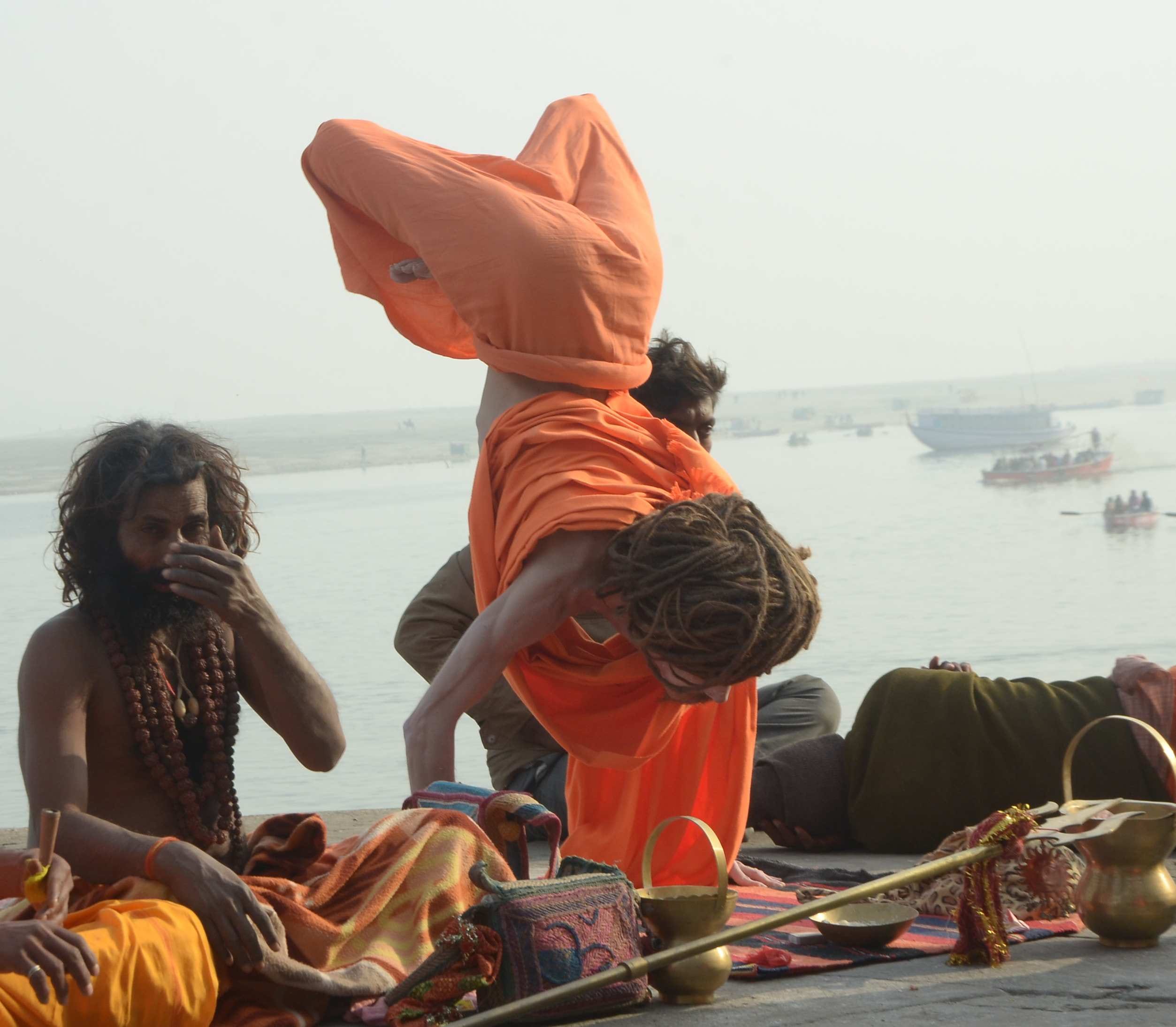 Foreign saint yoga on varanasi ganga ghat 