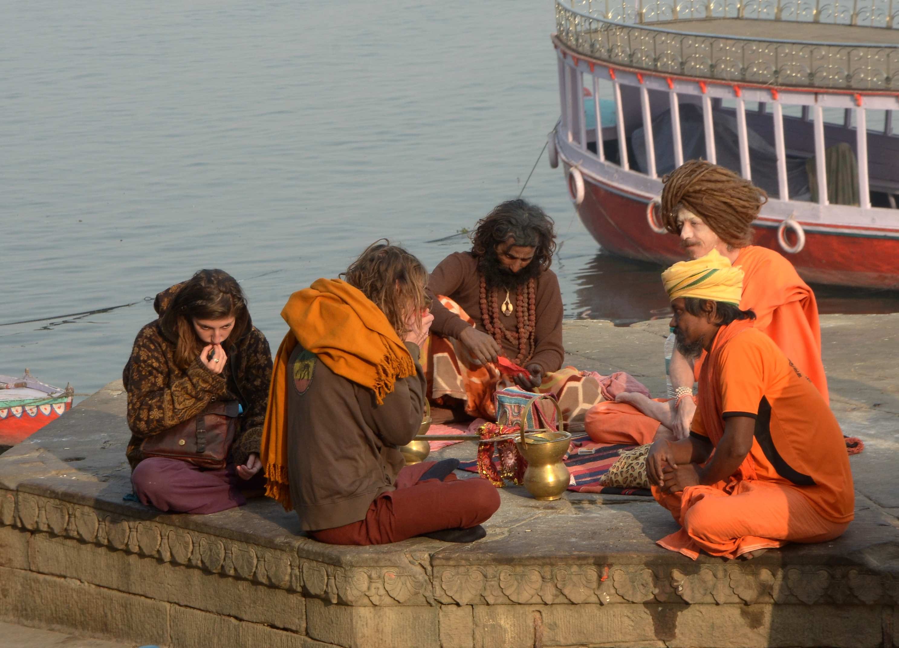 Foreign saint yoga on varanasi ganga ghat 