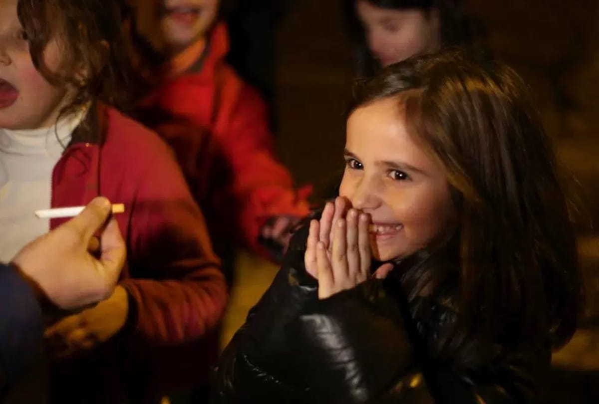 Children smoke cigarettes in this village celebrates traditional Epiphany 
