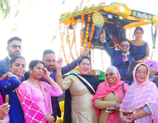 unique marriage in punjab, nri groom with bride arrives at reception on tractor