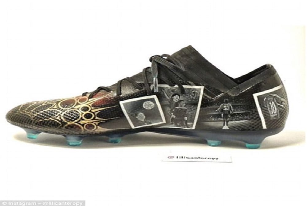 Lionel Messi receives a pair of hand-painted boots telling the story of the his career