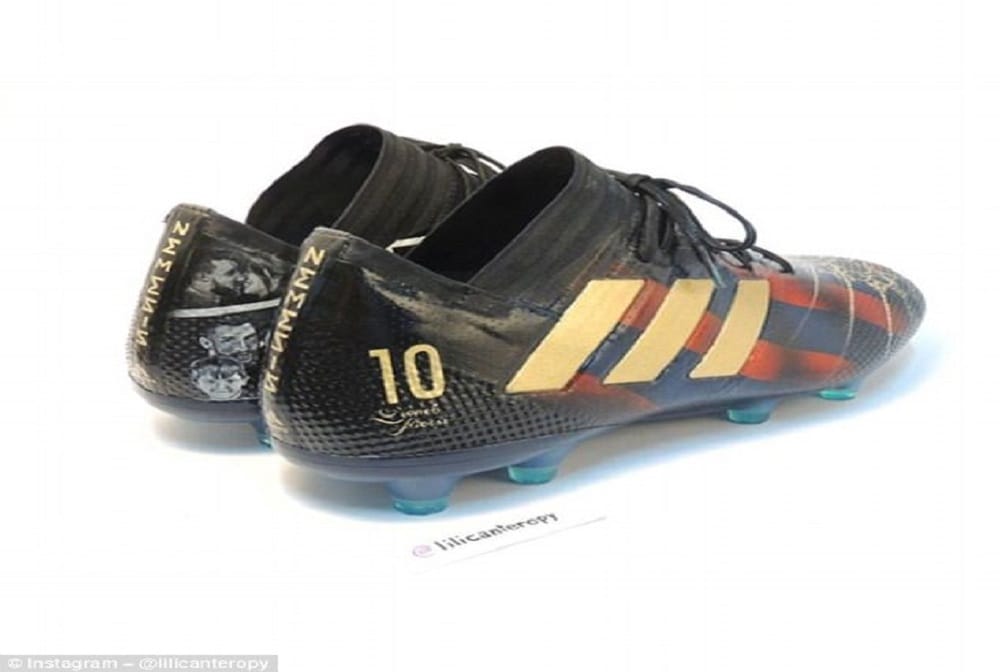 Lionel Messi receives a pair of hand-painted boots telling the story of the his career