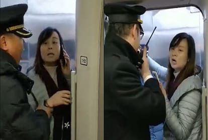 woman blocks door of high speed train for husband
