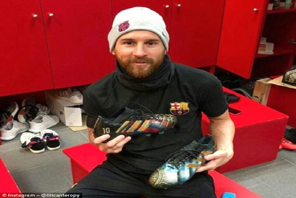 Lionel Messi receives a pair of hand-painted boots telling the story of the his career
