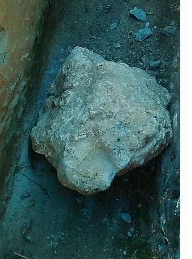 Boulder collapses from under road, children survive