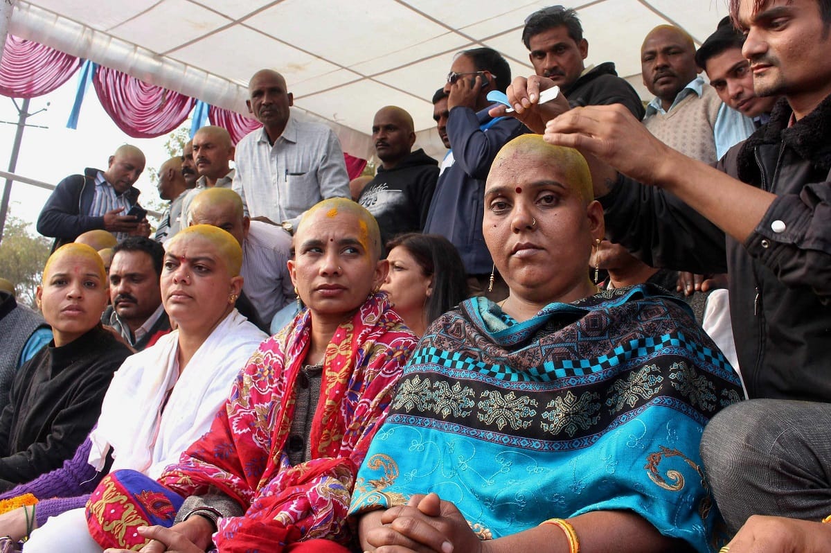 Teachers shaved their heads demanding equal pay for equal work in Bhopal