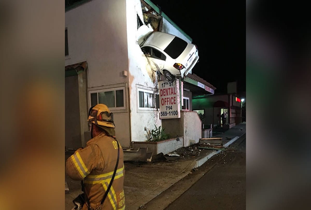 Driver crashes car into second story of a building at California 