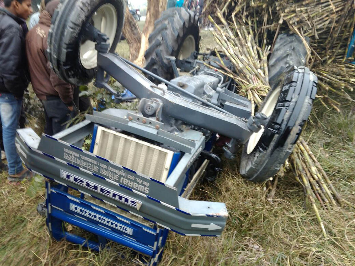 cane laden tractor trolley, driver serious