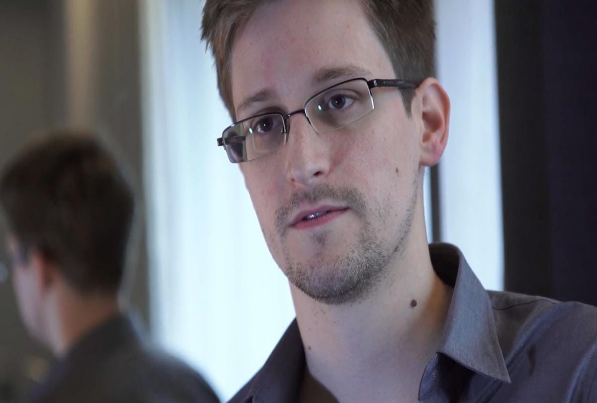 Russian President Vladimir Putin signs a decree granting Russian citizenship to Edward Snowden