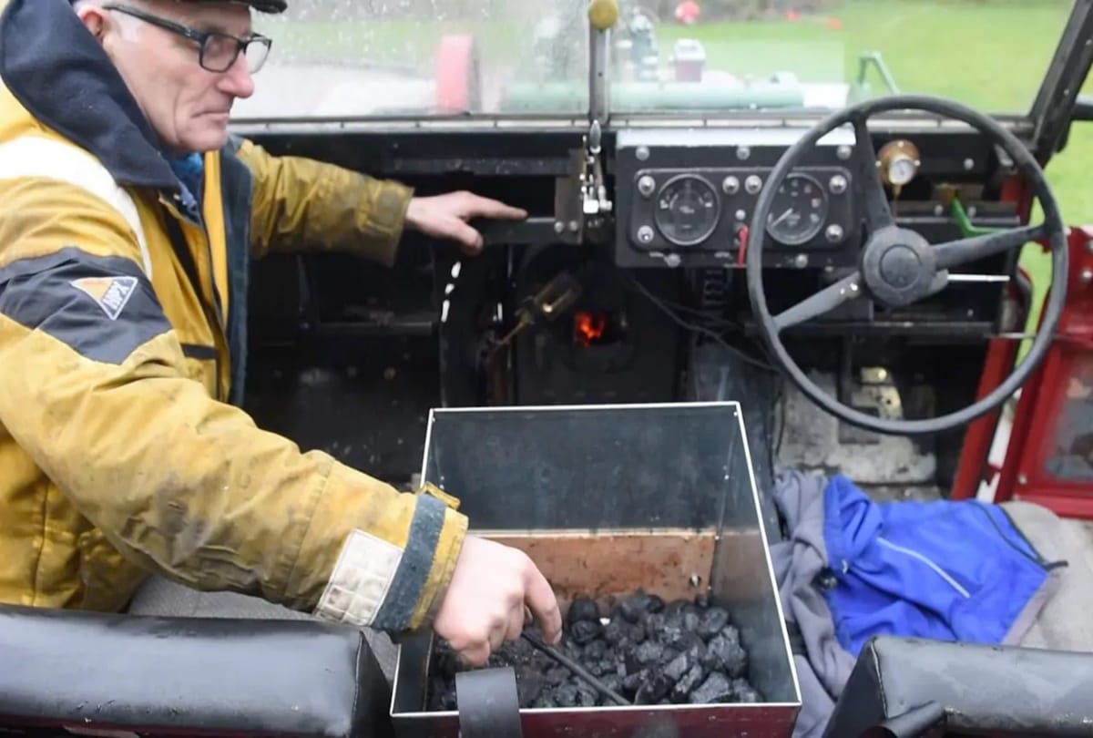 A Man converted land rover in steam engine car 