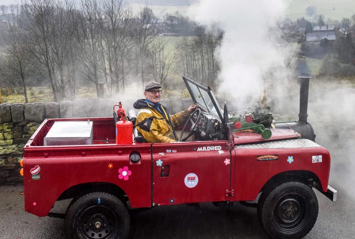 A Man converted land rover in steam engine car 
