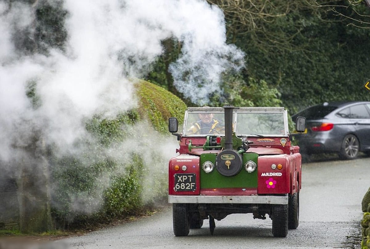 A Man converted land rover in steam engine car 