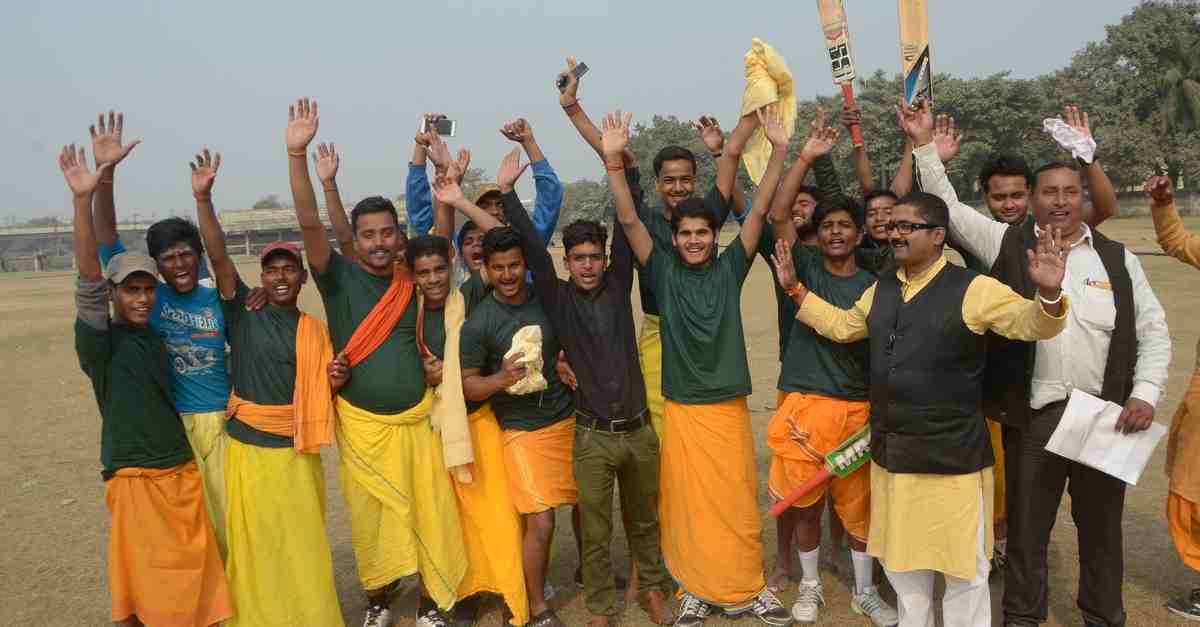 Student playing cricket match in dhoti kurta in varanasi
