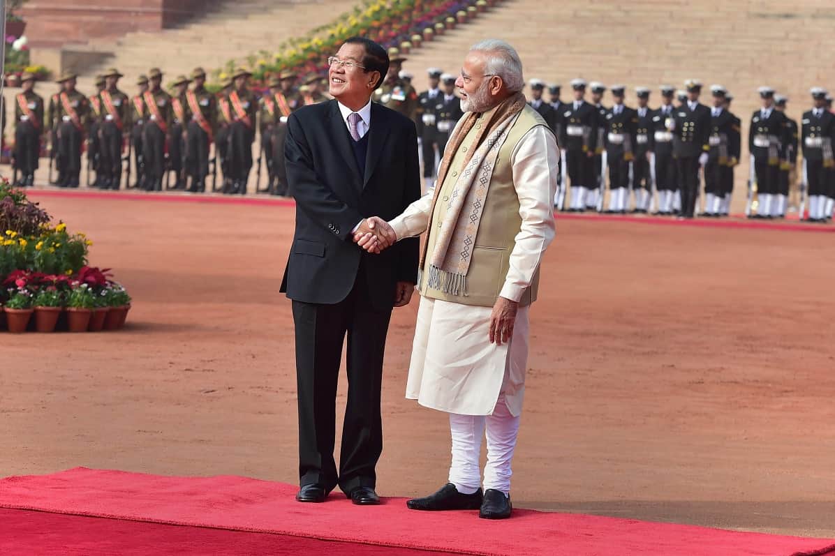 PM Narendra Modi greets his Cambodian counterpart Hun Sen during a ceremonial reception
