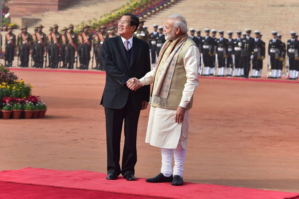 PM Narendra Modi greets his Cambodian counterpart Hun Sen during a ceremonial reception