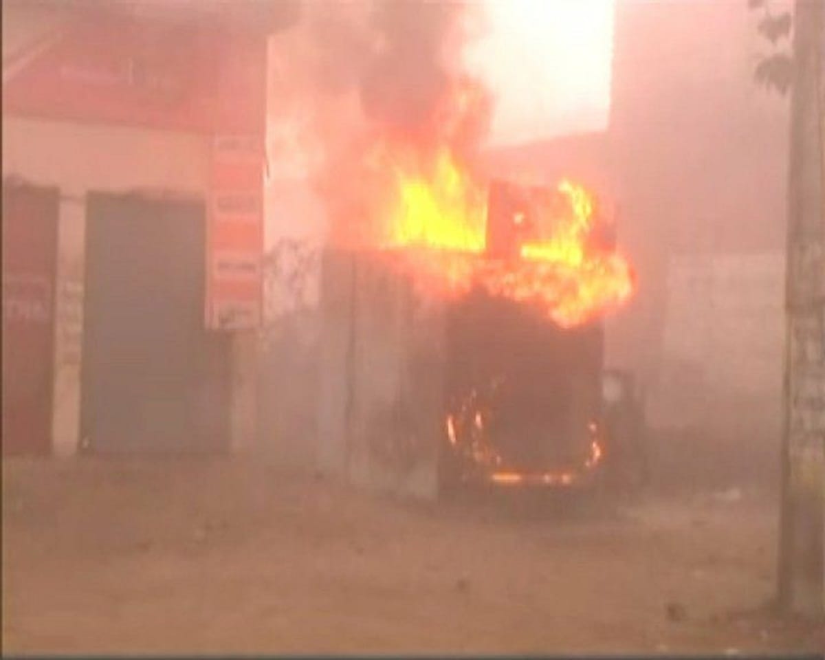 mob torched a wooden shop in kasganj