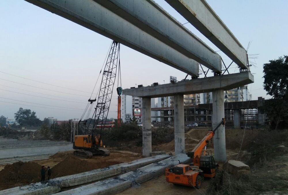 three injured when a beam falls down from an under construction flyover.