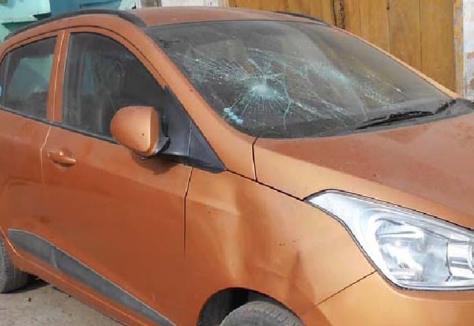 Chaos after hooligan break glass of cars and shop