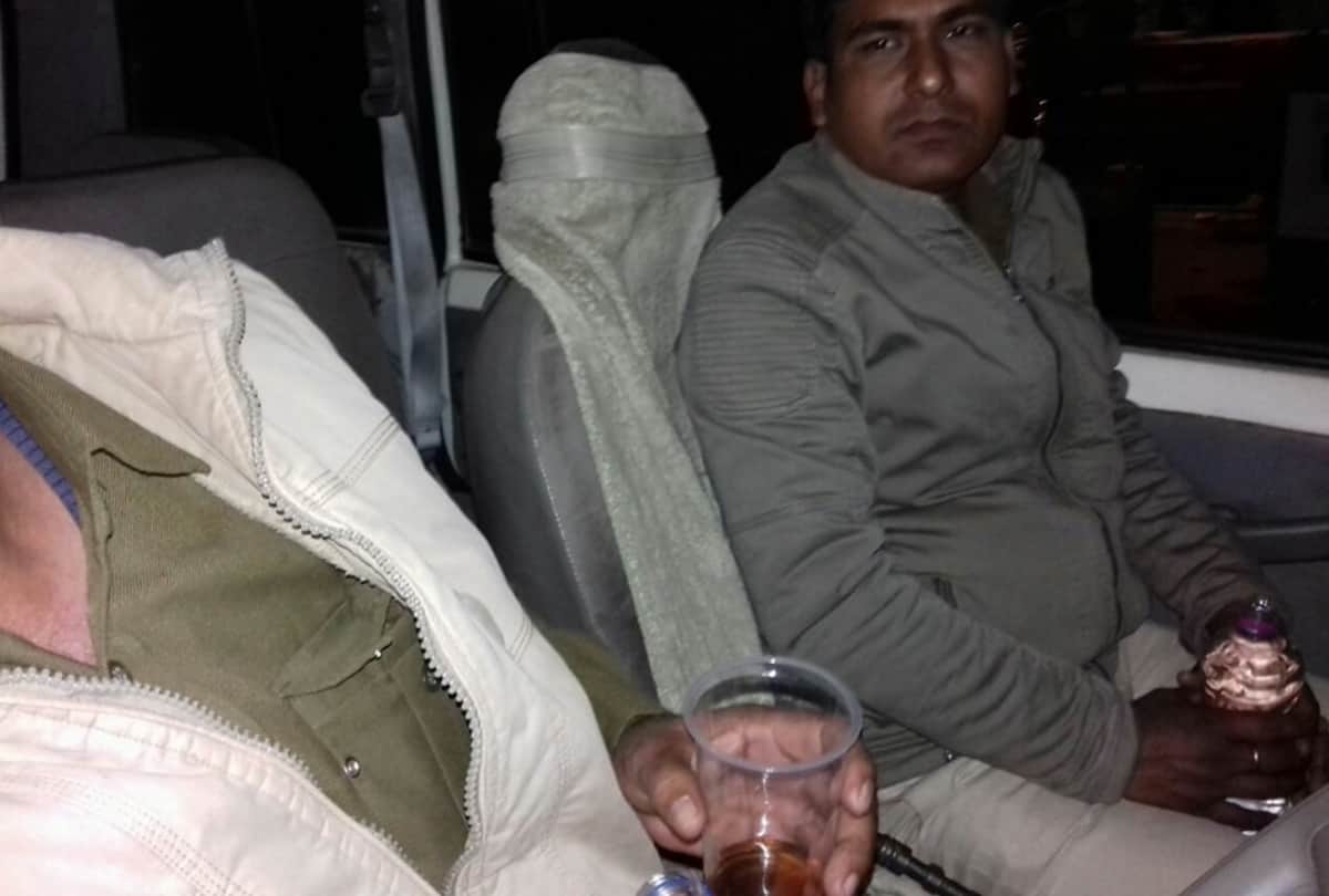 up policemen drinking alcohol in service cab on duty in ghaziabad  