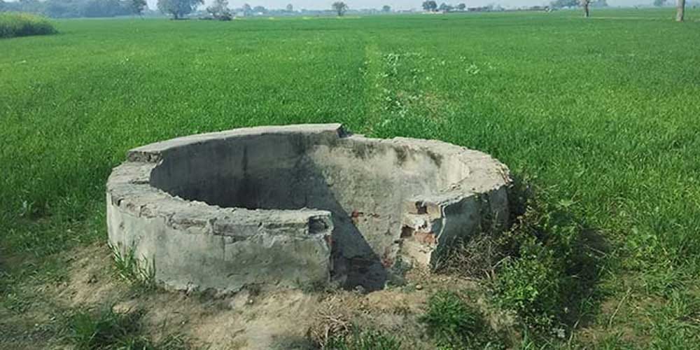 two woman jumps in well