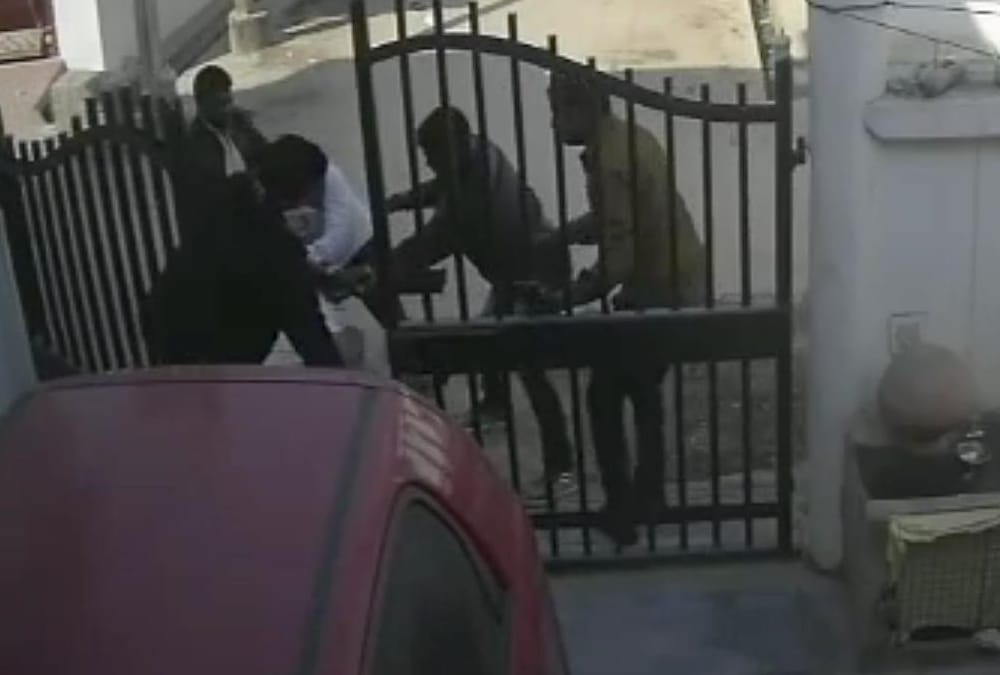 A woman fired on attackers who were beating her husband.