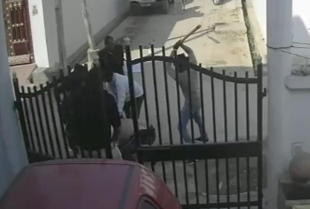 A woman fired on attackers who were beating her husband.