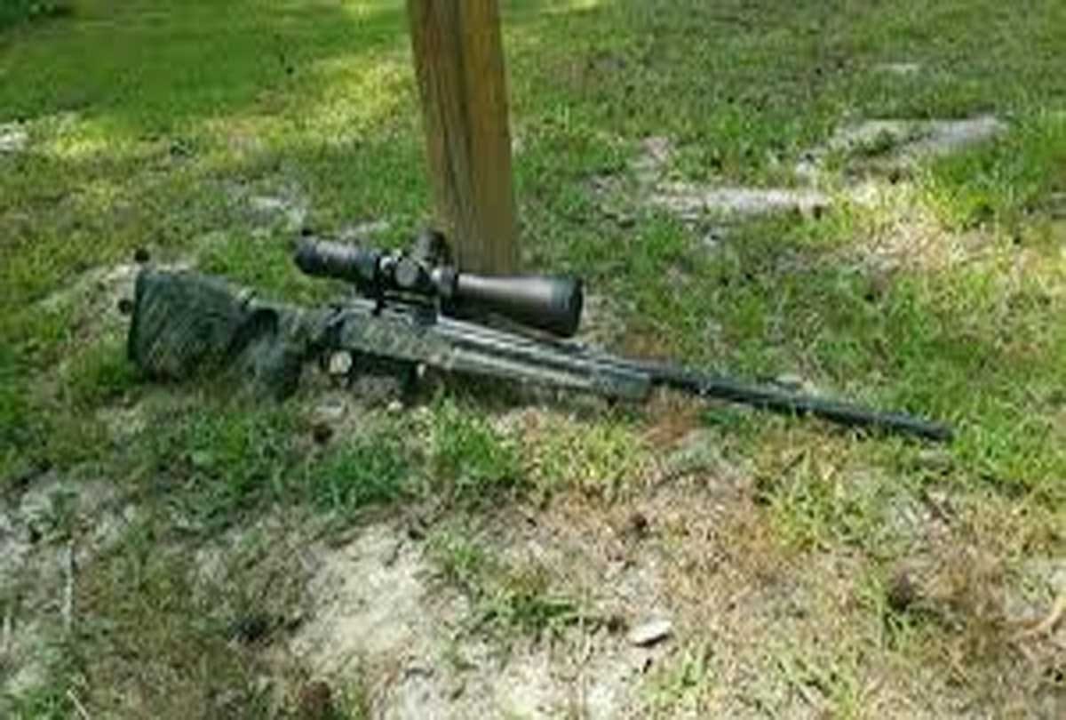student post photo with gun