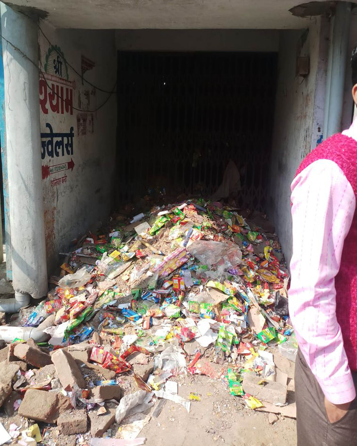 Nagarpalika employee threw the trash inside the shop  Garbage