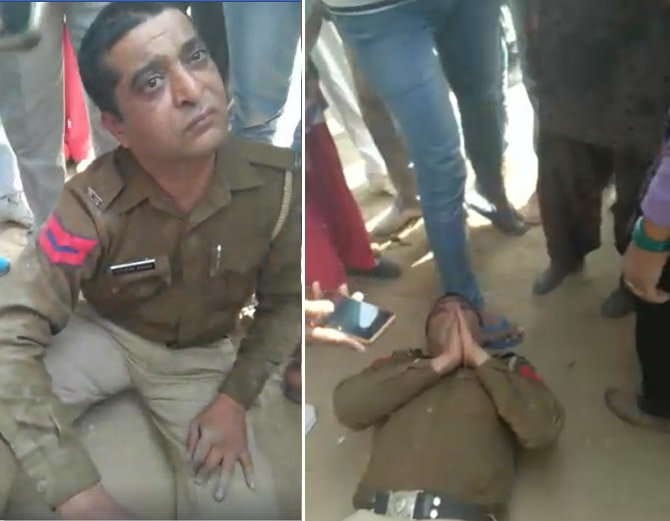 drunk police man beaten up on road in hisar