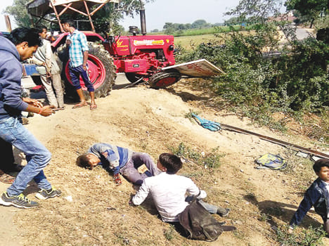 Tractor hits four students on Highway