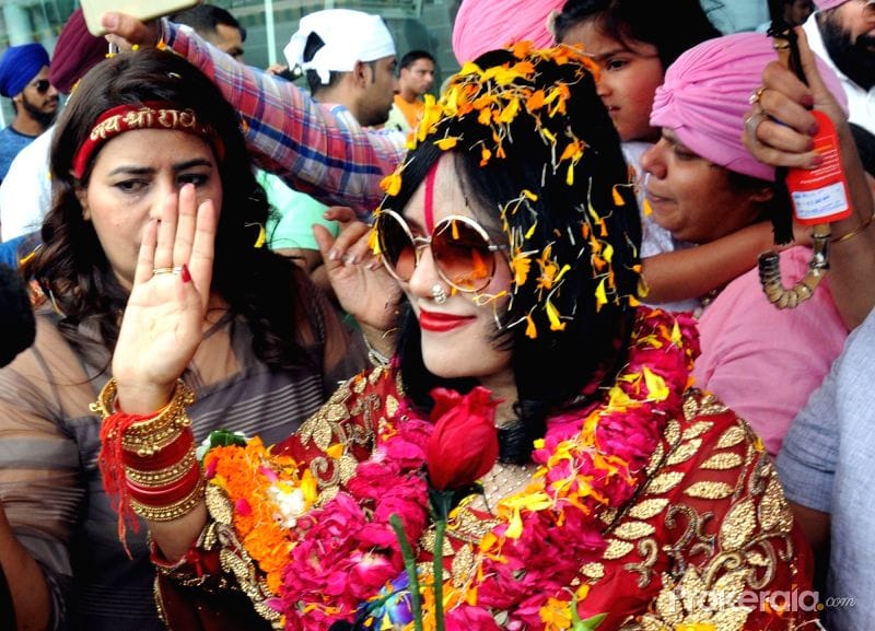 Self Styled God Woman Radhe Maa in Red Colour Gown