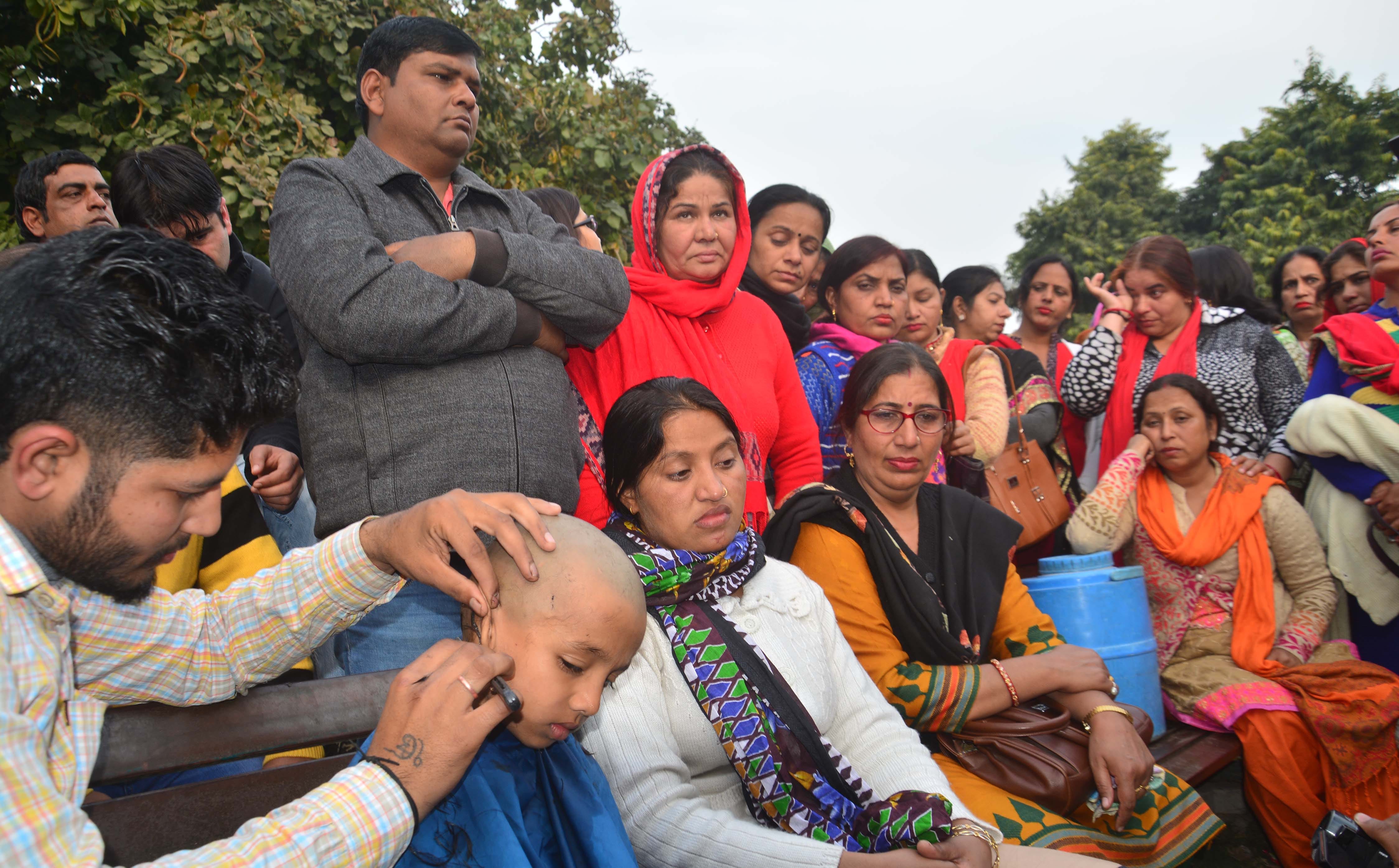 lady guest teacher shaved off head with son in haryana