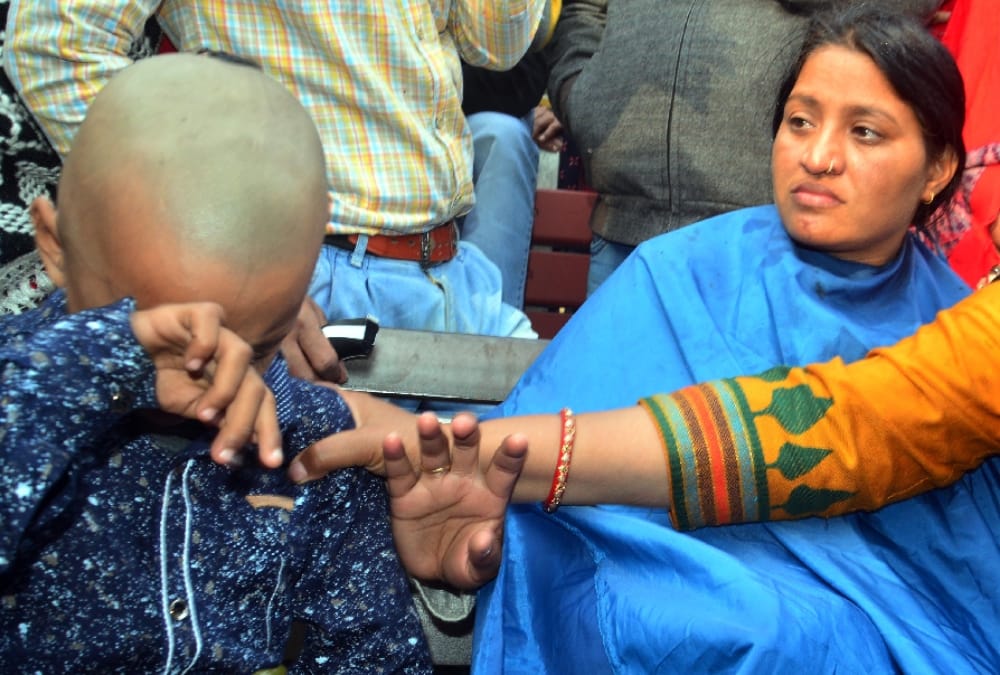lady guest teacher shaved off head with son in haryana