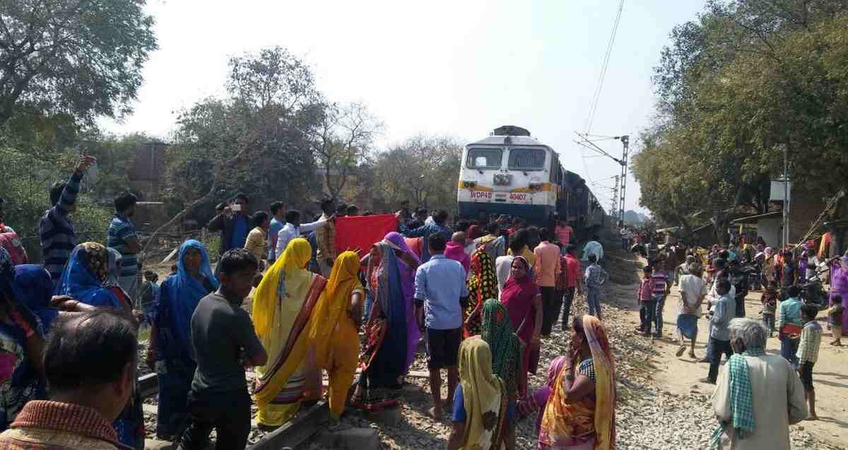 Villagers stop train on track