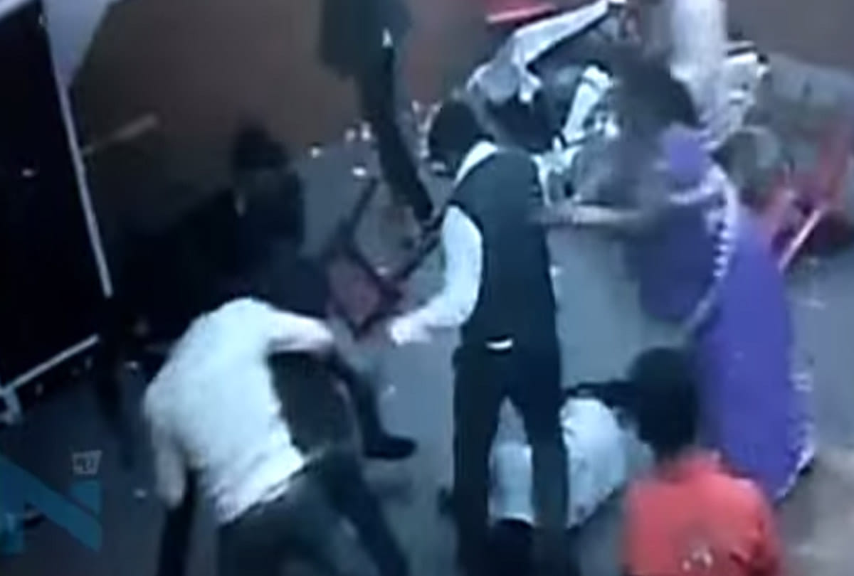 fight in wedding taking selfie with bride