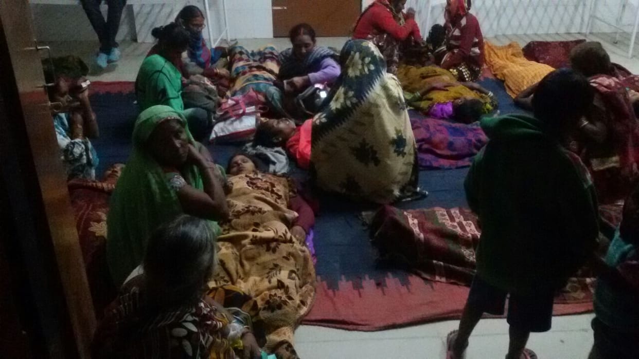 Women laying on the floor by doctor after operation