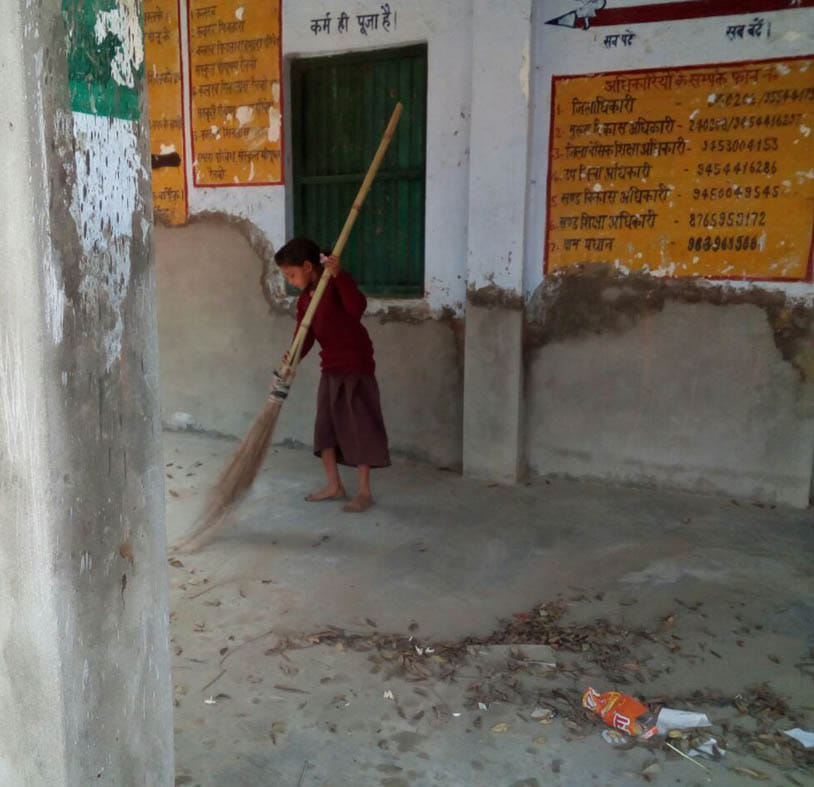 Guru was absent, children were putting broom