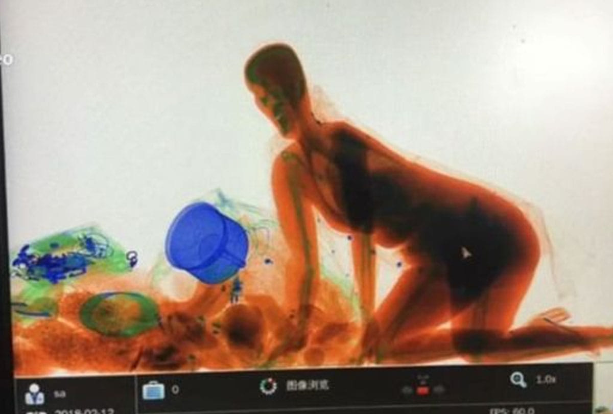 for bag safety woman entered into X ray checking machine in china