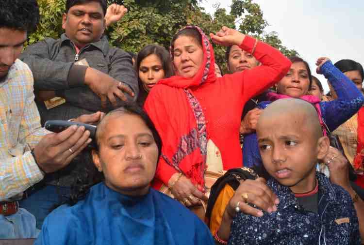 lady guest teacher shaved off head with son in haryana