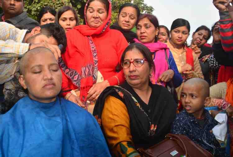 lady guest teacher shaved off head with son in haryana