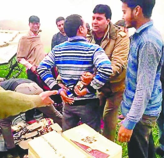 iquor loaded vehicle Inverted  in the field, bottles were robbed by people 