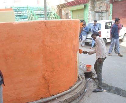 mathura barsana is being painted with saffron color
