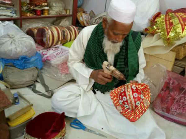 kishan making dress and Gayasuddin making safa for baba vishwanath gauna