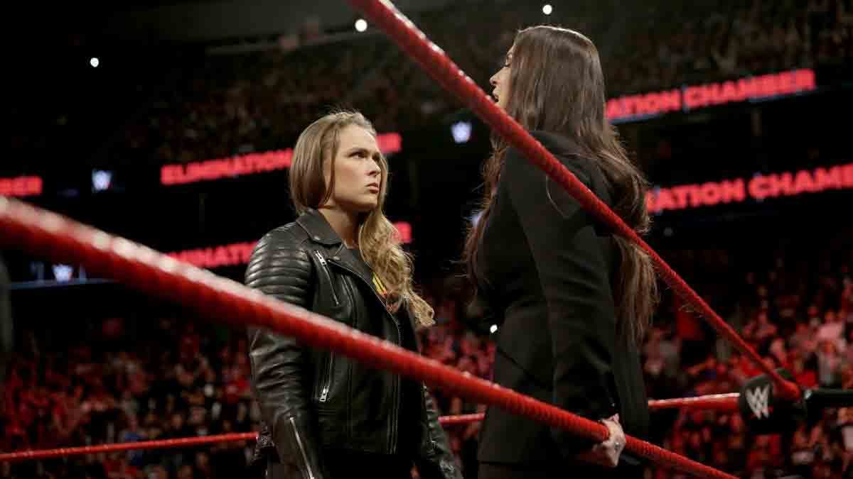 elimination chamber 2018 Ronda Rousey signs WWE contract after putting Triple H into the table