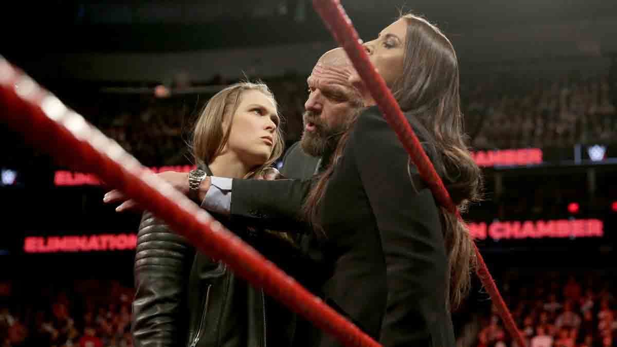 elimination chamber 2018 Ronda Rousey signs WWE contract after putting Triple H into the table
