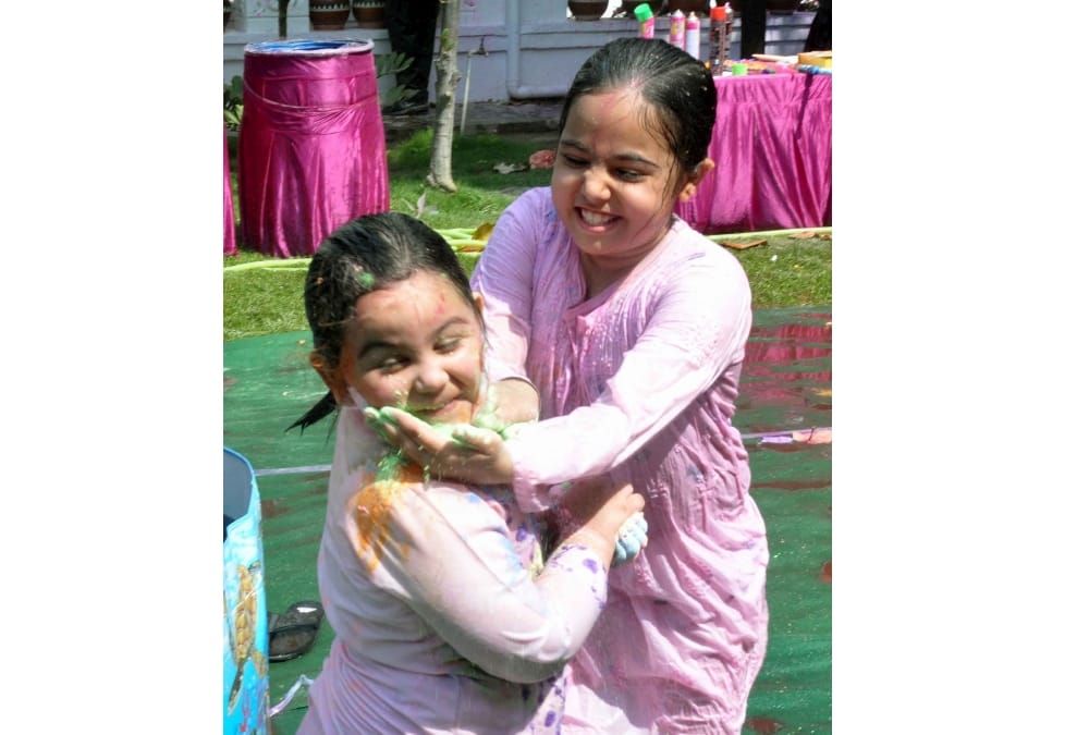 mulayam singh's younger daughter in law plays holi.