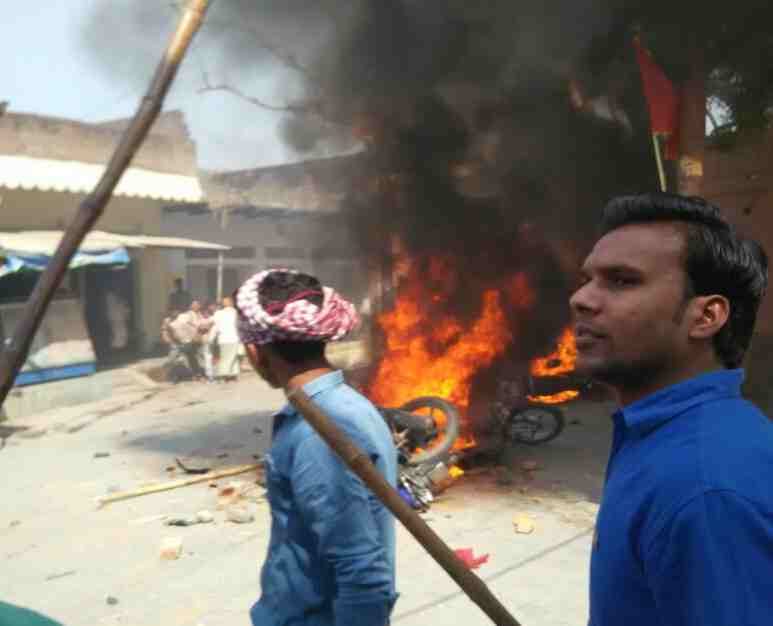 heavu outrage and burn bike in bhadohi for colour dispute