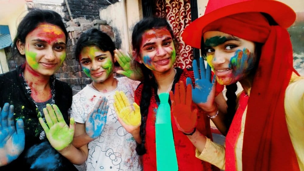 people with abir gulala and color